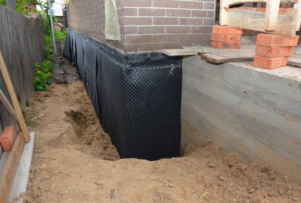 Happy homeowners after waterproofing job in Long Lake